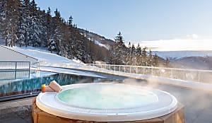 Family friendly all-inclusive ski resorts: beautiful resort with views overlooking the Alps